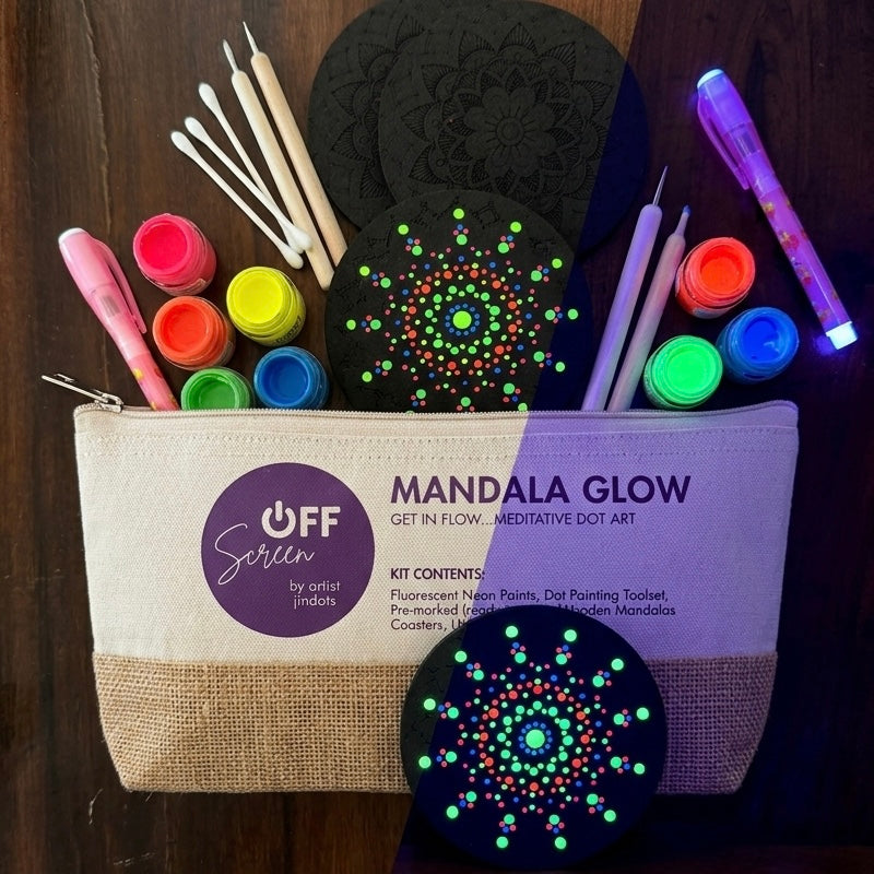 "Mandala Glow UV fluorescent paint set and acrylic dotting tools on black surface"