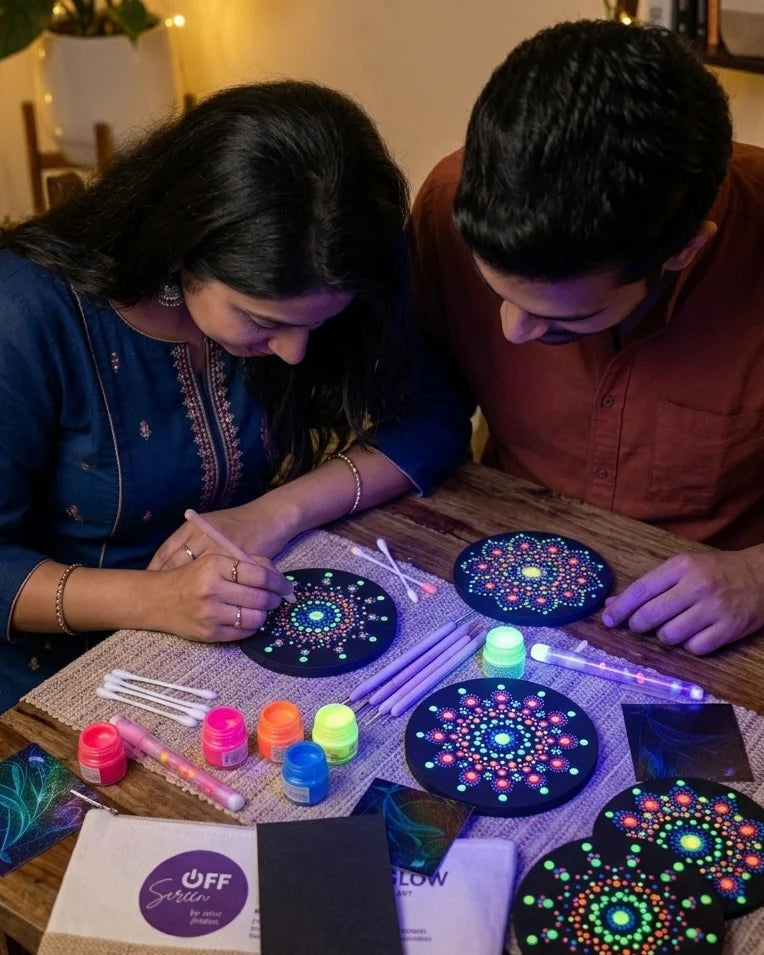 Mandala Glow - Screen free activity workshop - offscreen experience - couple enjoying panting a mandala together that glows in dark