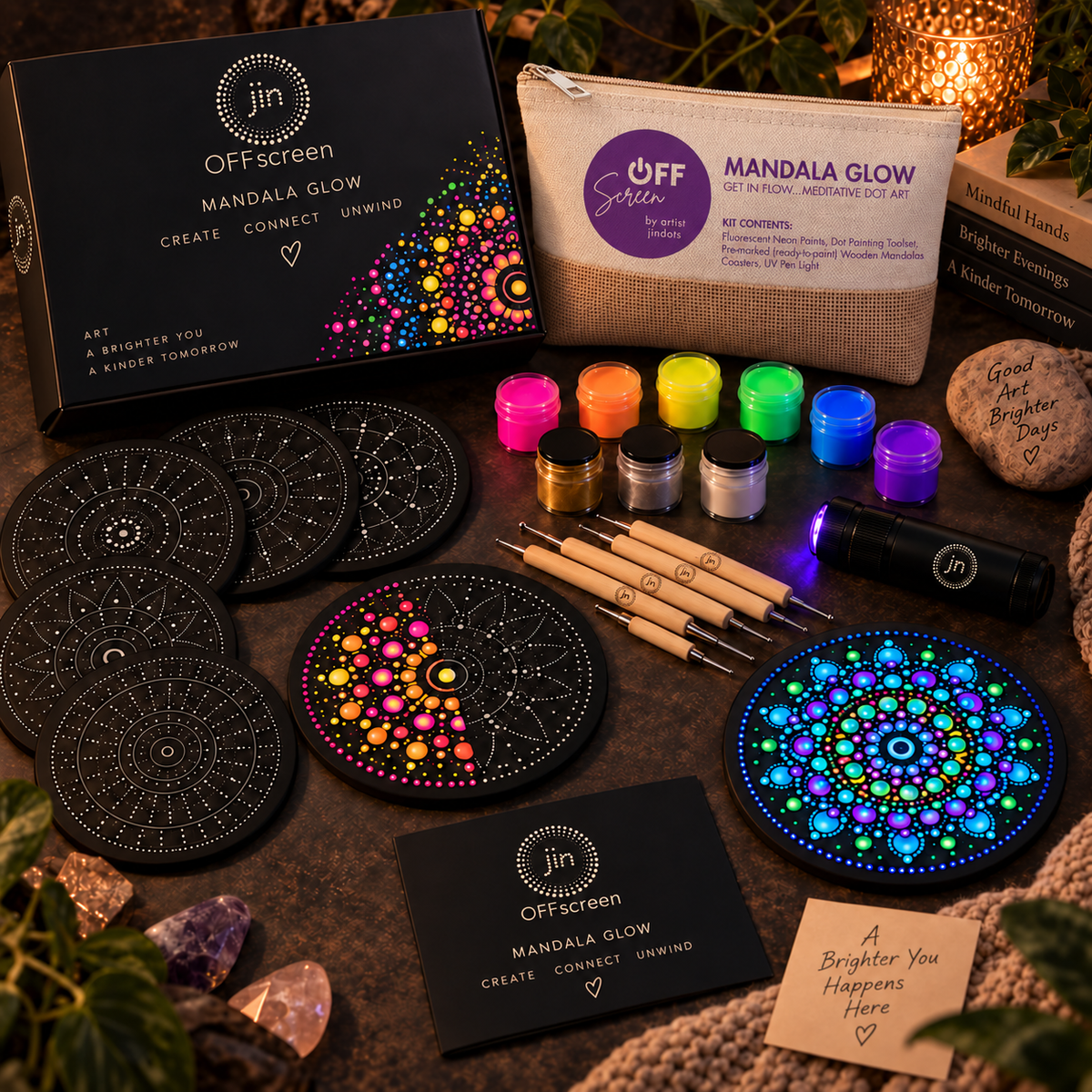 Mandala Glow full kit flat lay with pre-marked mandalas, fluorescent paints, dotting tools and UV light